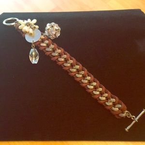 Toggle bracelet.  Leather and metal strap.